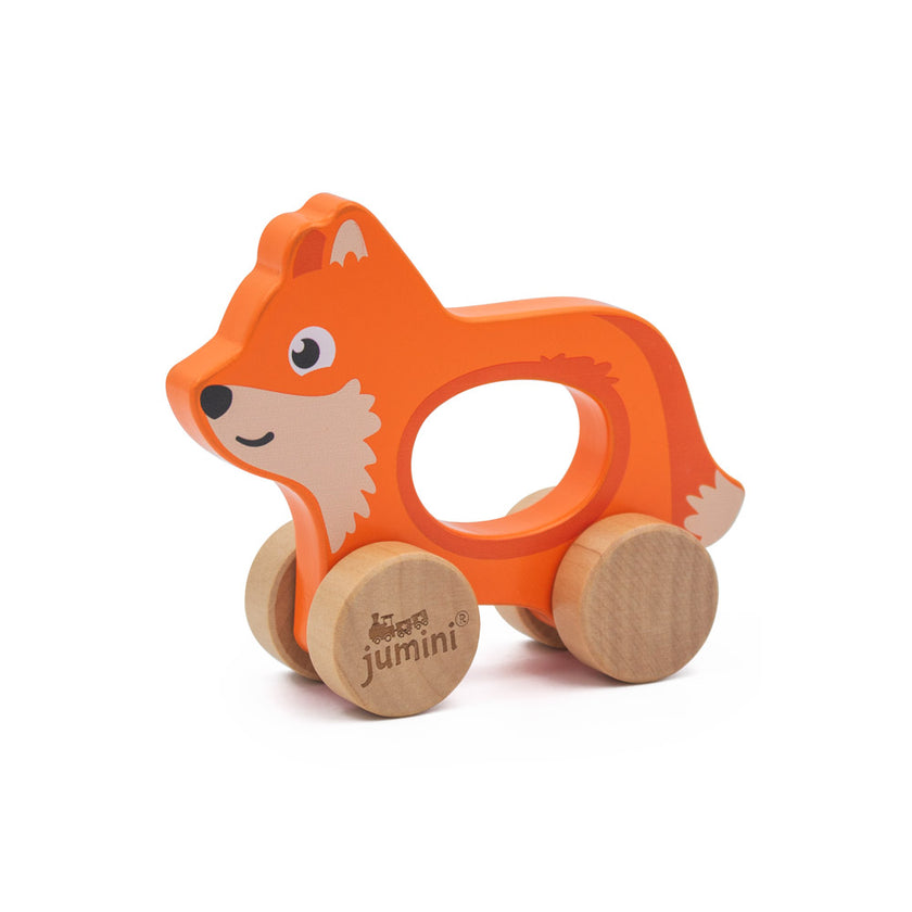 Wooden fox toy with wheels on a white background