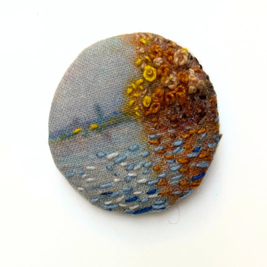 Anita Reynolds brooch based on Monet's Argenteuil Basin with a Single Sailboat in close-up