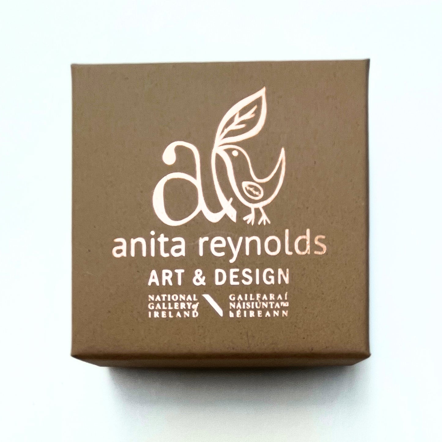 Anita Reynolds brooch box featuring the National Gallery of Ireland logo