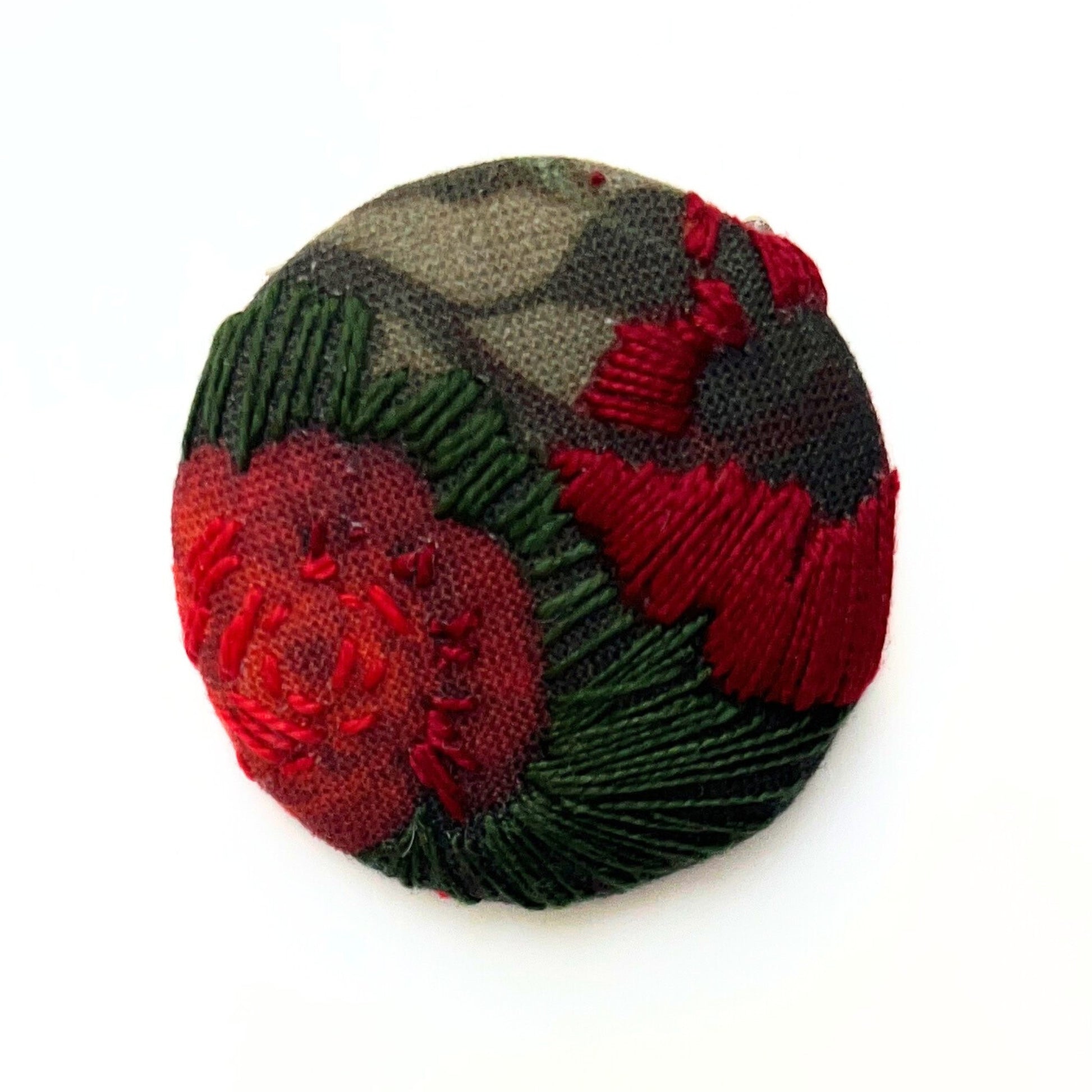 Anita Reynolds brooch based on Vase of Flowers with an Ear of Corn by Ruysch in close-up