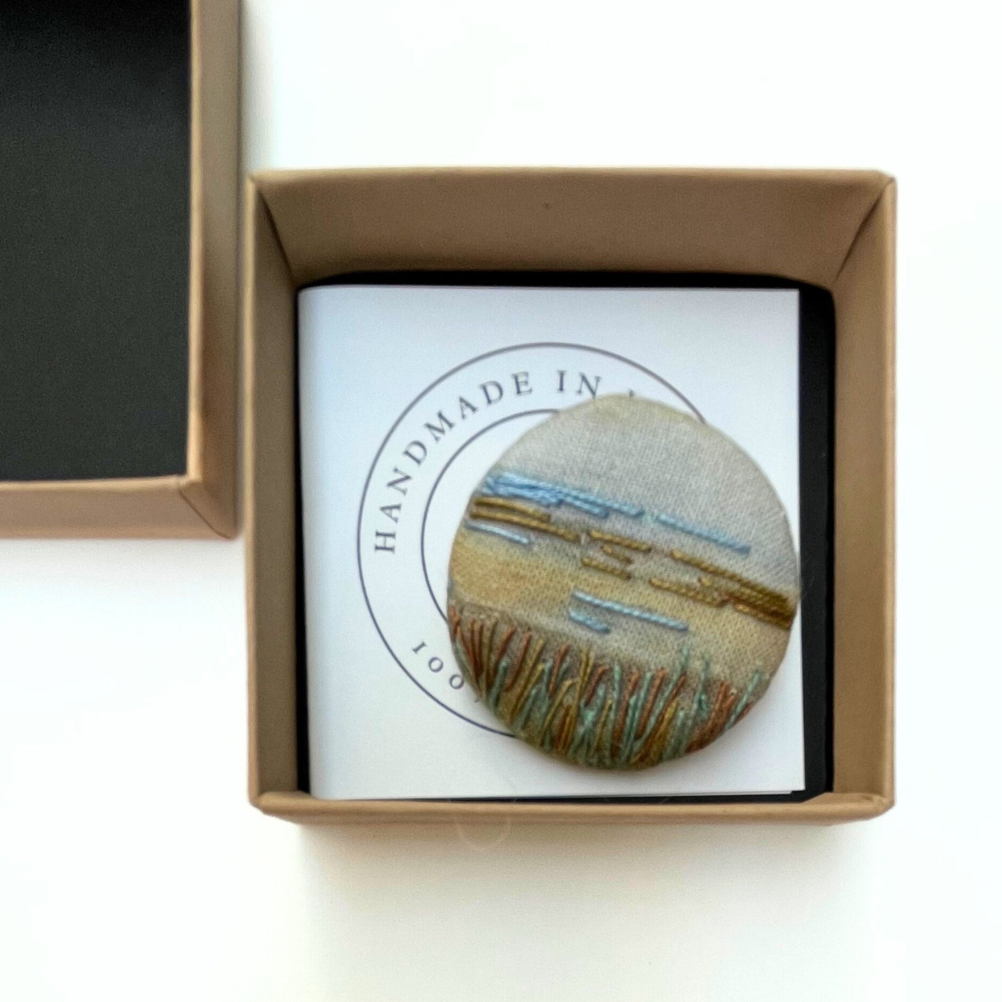Anita Reynolds brooch based on Eva Gonzalès's Children on the Sand Dunes in its box