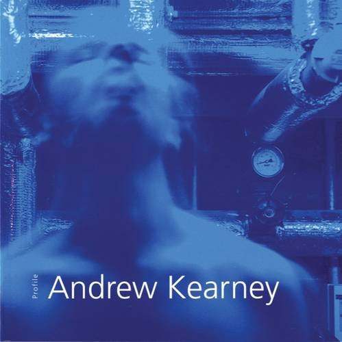 A blue photograph of a man from the shoulders up with a blurry head, as if moving, in front of pipes. The title is in the bottom in thin white letters.