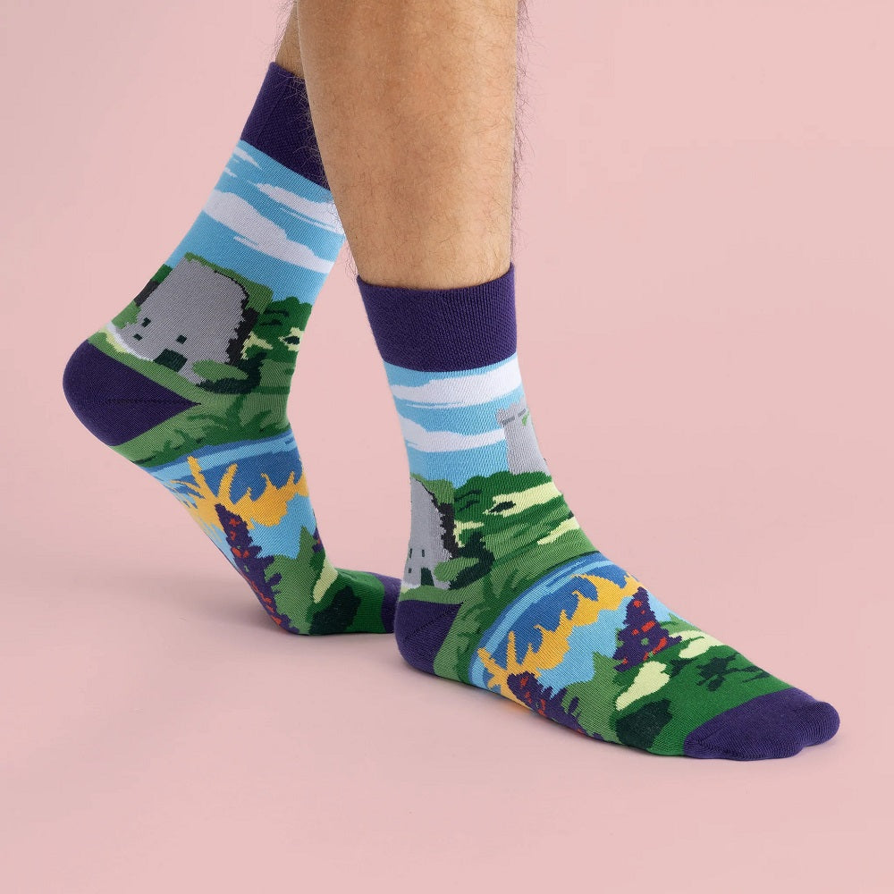 The socks on feet. The toe, heel and band are a matching purple to the flowers.