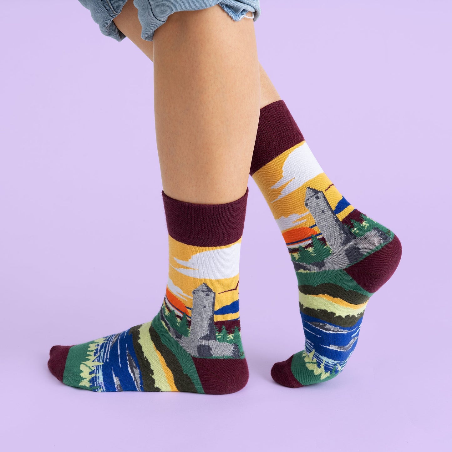 The previous socks on a models feet showing the design wrapping around the sock.