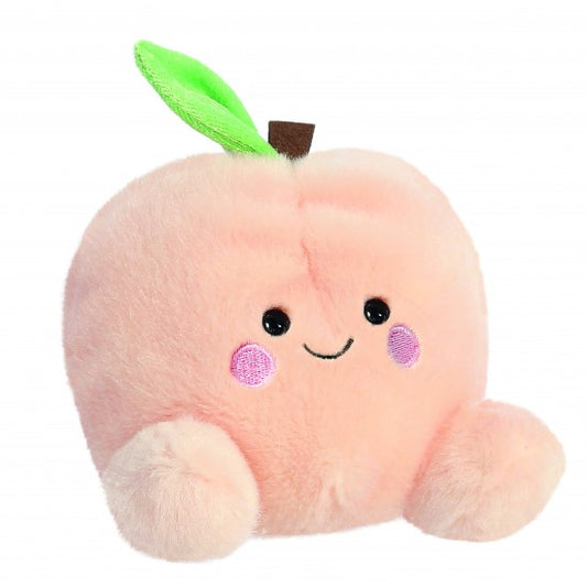 Plush peach toy with a smiley face. 