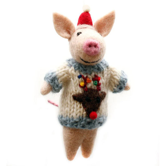 A handmade wool felt piglet toy wearing a Christmas jumper with a hanging loop.