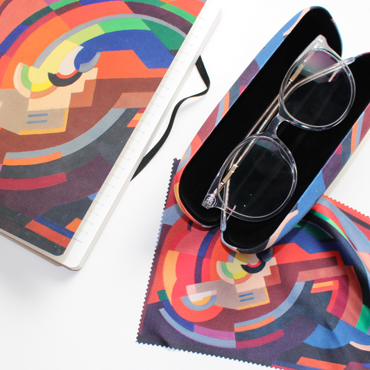 Notebook, glasses case and lens cloth all featuring A Composition by Mainie Jellett on a white background, with a pair of glasses in the open glasses case