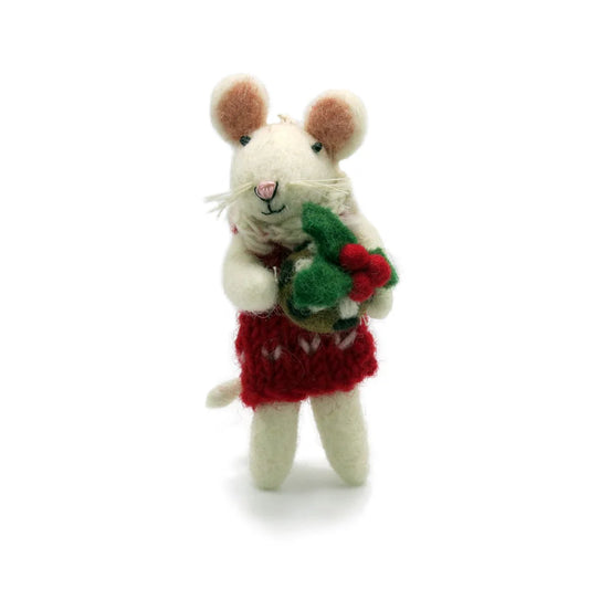 A handcrafted toy mouse made from wool felt, wearing a red and white outfit and holding a Christmas decoration.