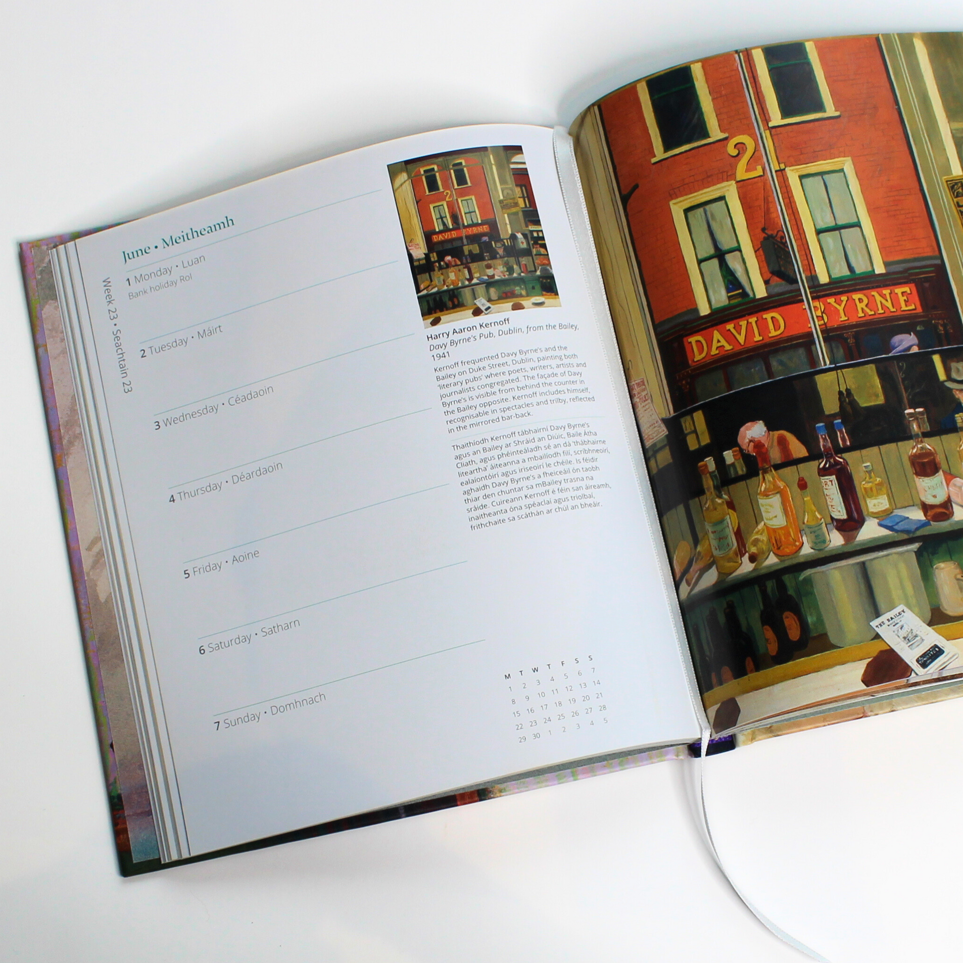 National Gallery of Ireland 2026 Diary open at a page in June featuring Harry Kernoff's oil on board work Davy Byrne's Pub.