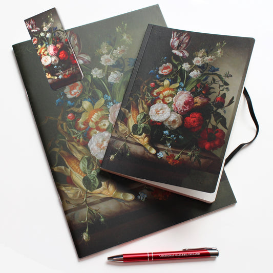A sketchbook, magnetic bookmark and notebook featuring Rachel Ruysch's Vase of Flowers with and Ear of Corn still-life painting on a white background, accompanied by a red National Gallery pen.
