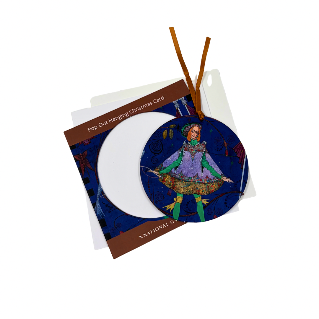 A circular pop-out hanging Christmas card featuring an illustrated figure in a purple and green outfit on a dark blue background, shown with its brown backing card and white insert on a white studio background.