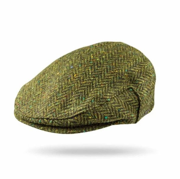 A classic flat cap in a textured green and brown herringbone tweed pattern, shown floating against a plain white background with a soft drop shadow.