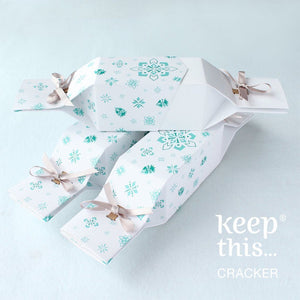 White reusable Christmas crackers with snowflake details