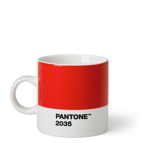 A short cup with a wide panel of red around the top two thirds. Underneath is a white stripe with ‘Pantone 2035’ in small black capitals. It has a small white handle and white inside.