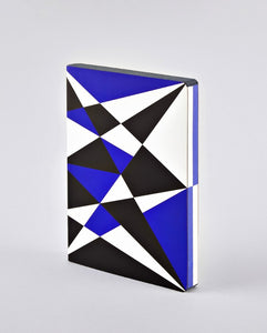 A notebook covered in an angled geometric pattern in white, black, and blue, that continues onto the paper edges.