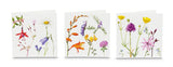 Three cards standing, each one has a different collection of painted flower illustrations on a white background.