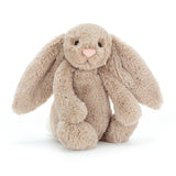 A beige classic cuddly rabbit with long ears and a pink nose.