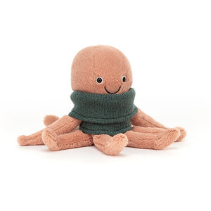 A light pink, soft octopus toy with a smiling face wearing a green knit polar neck top.