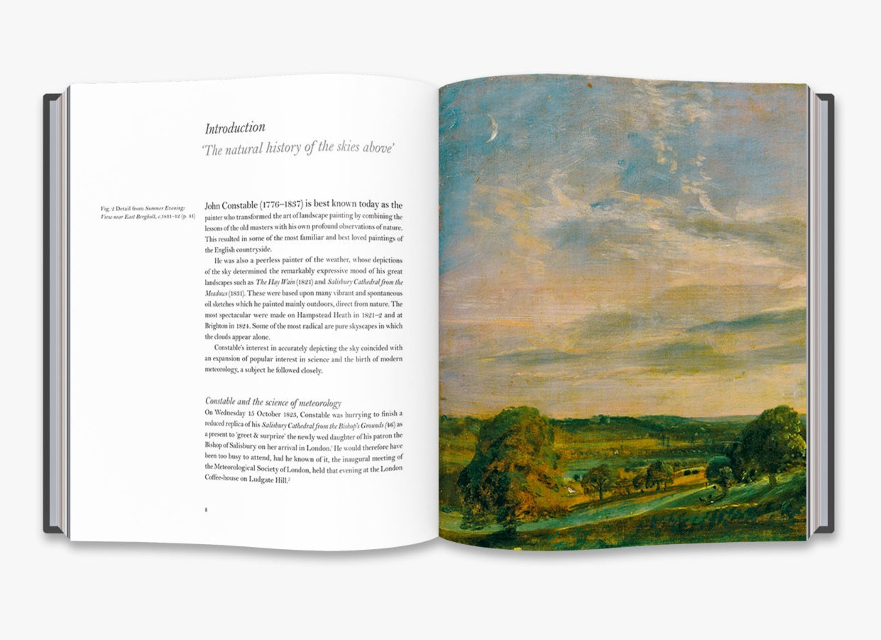 A two page spread from inside the book. The left page is the introduction with text. The right page a painting of an evening sky over green fields and trees.