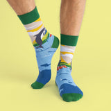 The previous socks on a models feet showing the design wrapping around the sock.