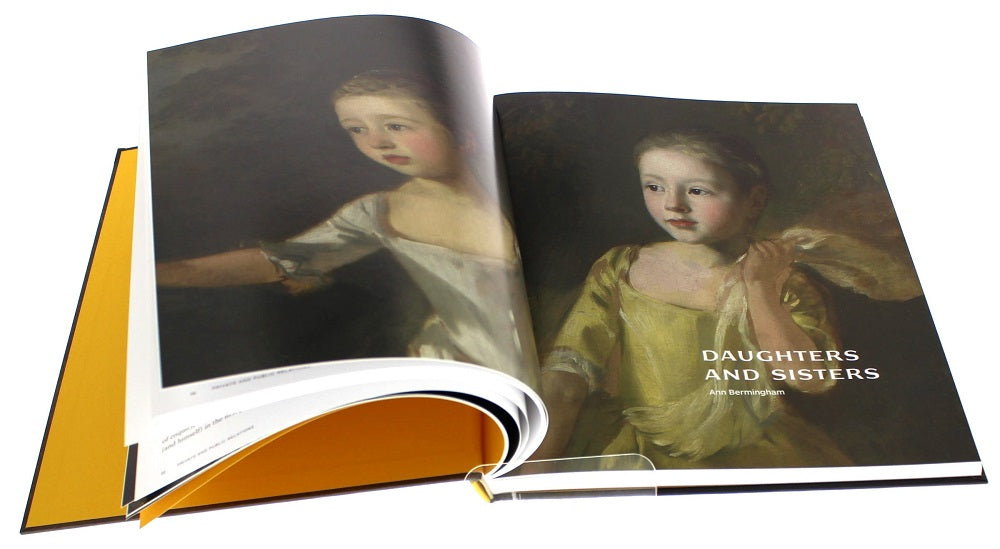 The book open showing a chapter start with a full painting across two pages of two young girls. The chapter title is in white.