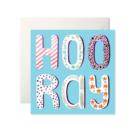 A blue card with ‘Hooray’ written in large bubble letters, taking up the whole card. Each letter has a different pattern inside such as stripes, dots or stars.
