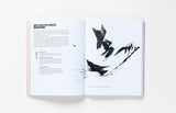A two page spread about Chinese brushwork with text on the left, and black brush strokes on the right.