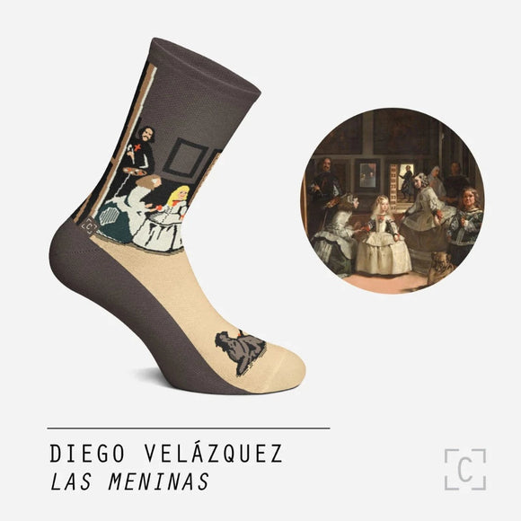 A sock of an artist painting a group portrait of a well-dressed family on a foot mannequin beside the painting it is based on.
