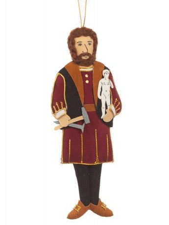 A felt man with a brown beard, wearing a tunic and vest detailed in gold, holding a hammer and pic in one hand and a mini white David statue in the other, and hanging from a gold thread.