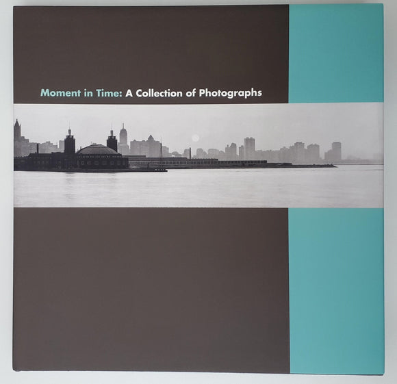 A background of dark grey with a light blue bar down the right side. Across the centre is a black and white panromantic photo of a city against a river. The title is above in small blue and white letters.