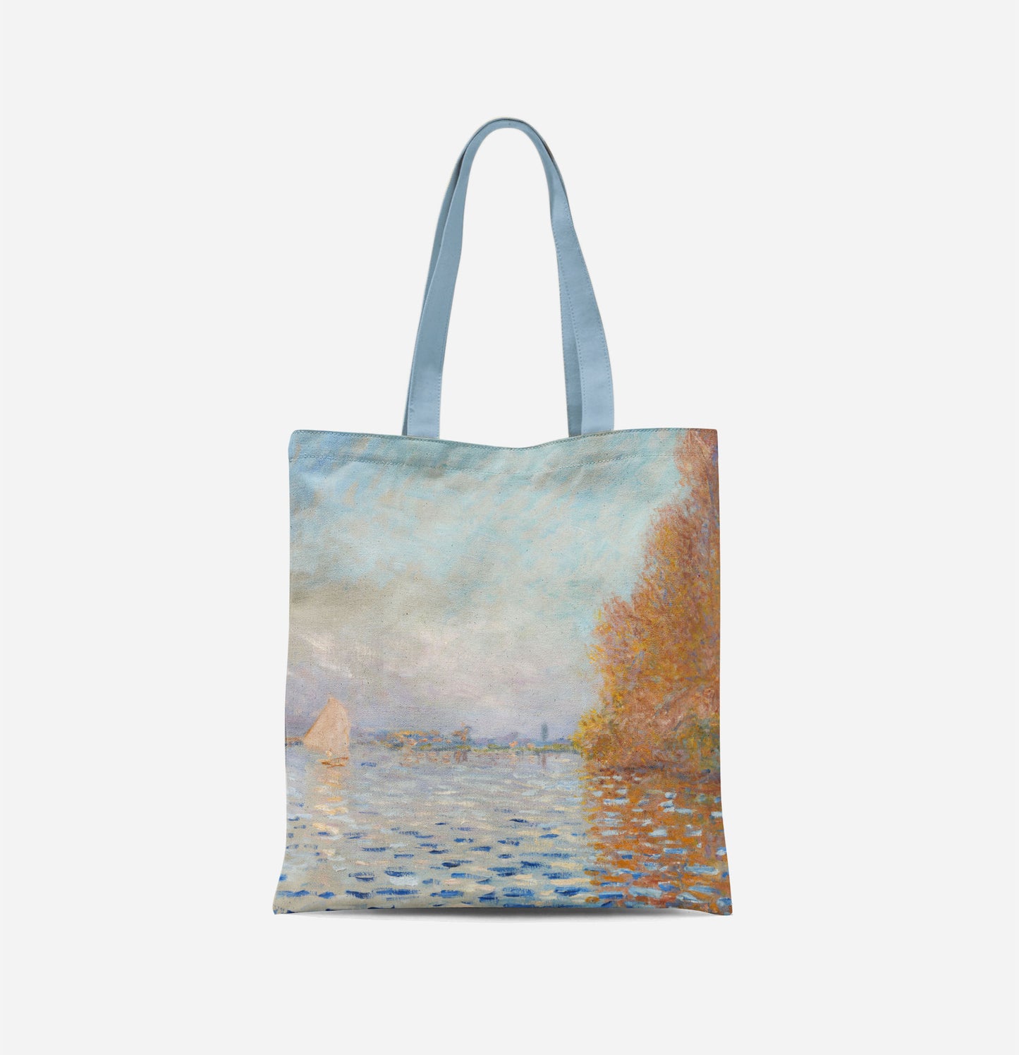 A bag with long light blue handles covered in an impressionist painting of a light blue sky reflecting in a lake, with a large autumnal tree to the right and a small white sail boat to the left.