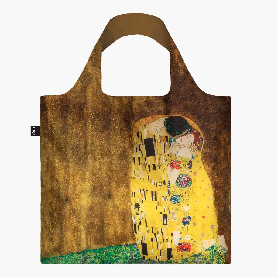 A square bag with a painting of a couple embracing on grass, both wearing patterned yellow, with the man kisses the woman’s cheek. All against a golden brown background. The handle lining is a matching brown.