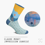 A simple sunset in yellow and blue around the leg, a light blue foot with dashes of blue to create a sea.
