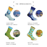 Four pairs of socks on foot mannequins beside the paintings they are inspired by.