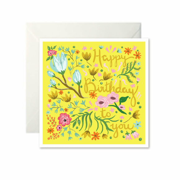 A bright yellow card with drawings of flowers. ‘Happy birthday to you’ is written down the left in dark yellow cursive, mixed in with the flowers.